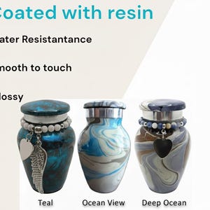 May include: Three decorative urns with resin coating, water resistant, smooth, and glossy. The urns are teal, ocean view, and deep ocean designs. Each urn has a silver lid, a beaded bracelet, and a charm. The text in the image says "Coated with resin".
