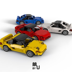 May include: Four miniature toy cars in different colours: yellow, red, white, and blue. The cars are all the same model and have a sleek, sporty design.