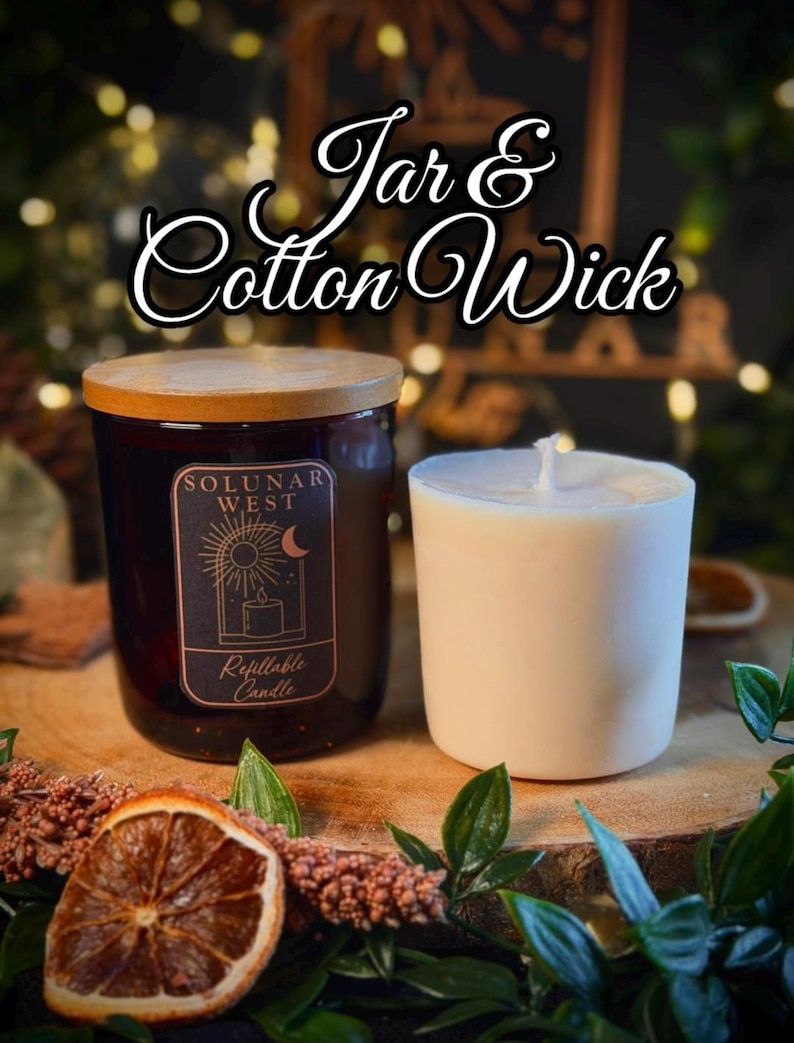 May include: A dark amber glass candle jar with a wooden lid and a Solunar West label, accompanied by a white wax refill insert featuring a cotton wick. The label displays a sun and moon graphic with the text Solunar West Refillable Candle.