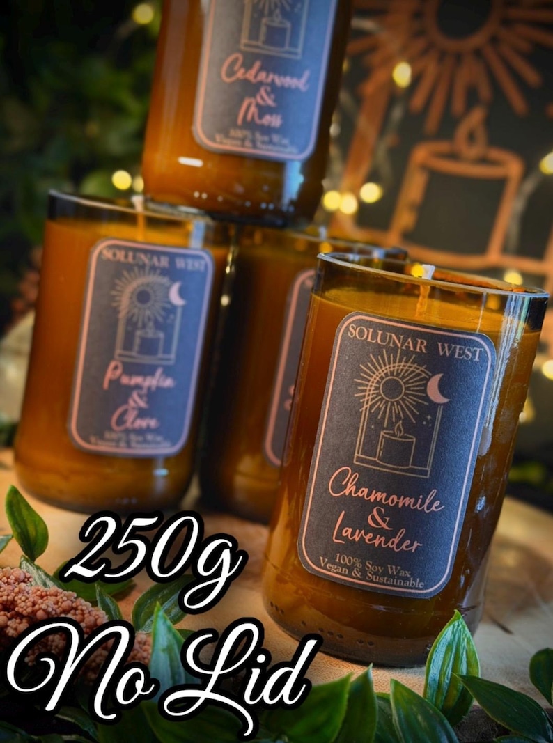 May include: Several glass jar candles with labels that read "Cedarwood & Moss", "Pumpkin & Clove", and "Chamomile & Lavender". The candles are 250g and made with 100% soy wax. The text "No Lid" is also visible.