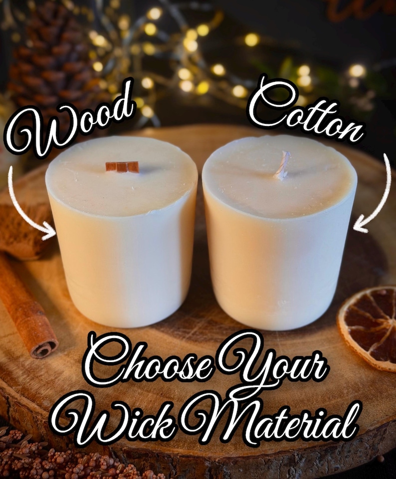 May include: Two cylindrical white candles, one featuring a flat wooden wick and the other a braided cotton wick. Text on the image reads: Wood, Cotton, and Choose Your Wick Material. The candles are presented side by side for comparison.