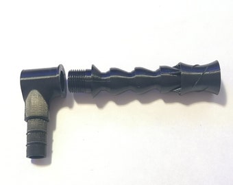 May include: A black plastic 90-degree elbow fitting with a threaded end and a hose barb. A black plastic hose with a threaded end is also shown.