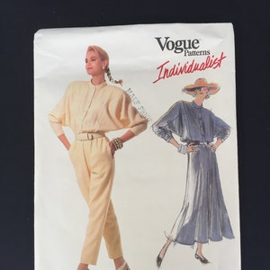 May include: Vogue Patterns Individualist sewing pattern by Carol Horn, pattern number 1840. The pattern features two illustrations of women wearing different outfits. The first illustration shows a woman wearing a yellow jumpsuit with a belt. The second illustration shows a woman wearing a blue skirt and a white blouse with a wide collar.
