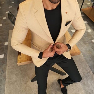 Beige suit jacket black pants 2025