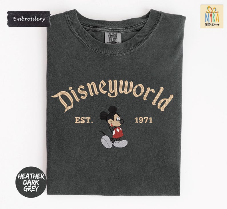 A gray t-shirt with a Mickey Mouse design and text that says "Disneyworld EST. 1971".