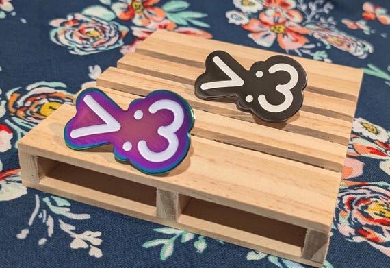 Emoticon >:3 Enamel Pin (Two Color Options)