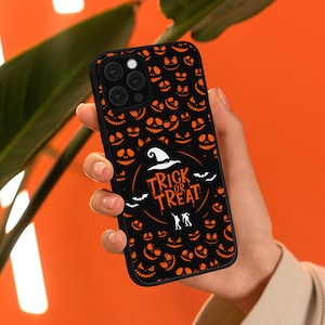 May include: Black phone case with an orange and black Halloween design. The design features jack-o'-lantern faces, bats, and the text "Trick or Treat".