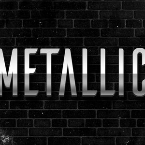 May include: Metallic text on a black brick wall background.