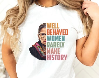 May include: White t-shirt with a colorful portrait of Ruth Bader Ginsburg and the text "Well Behaved Women Rarely Make History."
