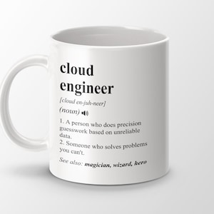 May include: White ceramic mug with a black design that defines a cloud engineer as someone who solves problems you can't. The text includes the pronunciation of the word "cloud engineer" and lists "magician, wizard, hero" as synonyms.