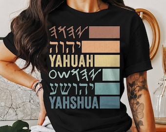 May include: Black t-shirt with a vintage-style design featuring Hebrew lettering and the words "YAHUAH" and "YAHSHUA".