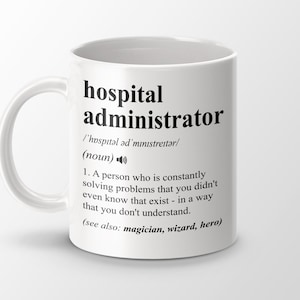 May include: White ceramic mug with a black and white design. The mug features a definition of the word "hospital administrator" with a humorous description.