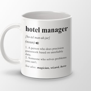 May include: White ceramic coffee mug with a black design that reads "hotel manager [ho-tel man-uh-jur] (noun) 1. A person who does precision guesswork based on unreliable data. 2. Someone who solves problems you can't. See also: magician, wizard, hero"