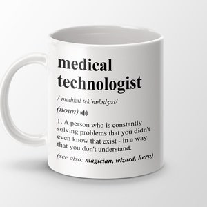 May include: White ceramic mug with a black design that reads "medical technologist" and defines the term as "a person who is constantly solving problems that you didn't even know that exist - in a way that you don't understand." The definition also includes "(see also: magician, wizard, hero)".