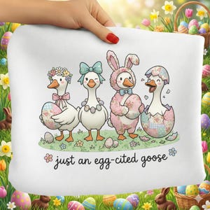 May include: White Easter-themed pillow with a cartoon illustration of four geese. The geese are decorated with bows, flowers, and a bunny costume, each holding a patterned Easter egg. Text reads "just an egg-cited goose."