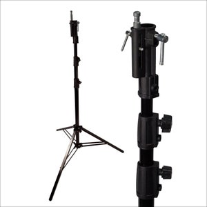 May include: A black metal photography light stand with a three-legged base and adjustable height. The stand has a telescoping center pole with multiple locking points.