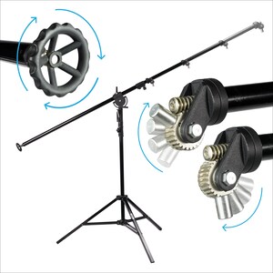 May include: A black camera boom arm with a tripod stand. The boom arm has a rotating handle and a gear system for adjusting the angle. The arm is extendable and can be adjusted to different heights.