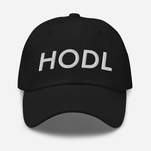 May include: A black baseball cap with a white embroidered "HODL" on the front.