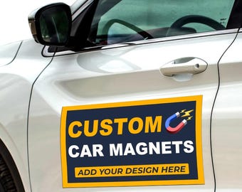 May include: A white car with a custom car magnet that says "CUSTOM CAR MAGNETS" in yellow letters on a blue background with a yellow border. The magnet also has a red and blue magnet icon with a lightning bolt. The text "ADD YOUR DESIGN HERE" is in yellow letters on a blue background.