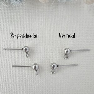 May include: Four silver earring findings, two with the post perpendicular to the loop and two with the post vertical to the loop. The words "Perpendicular" and "Vertical" are written above the findings.
