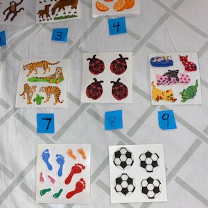 May include: A sheet of colorful stickers featuring various themes, including animals, sports, and nature. The stickers are arranged in rows on a white background.