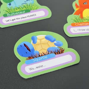 May include: Three colorful, die-cut cards featuring cartoon characters. One card shows Bulbasaur with the text "Let's get this place HUMID!". Another card shows Squirtle with the text "Wa...water...". The third card shows Charmander.