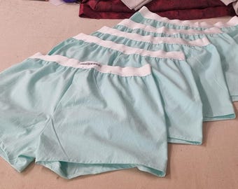 Calzoncillos bóxer de algodón orgánico natural turquesa para hombre, transpirables, cómodos y de origen vegetal, ideales como regalo para marido o novio en su aniversario.