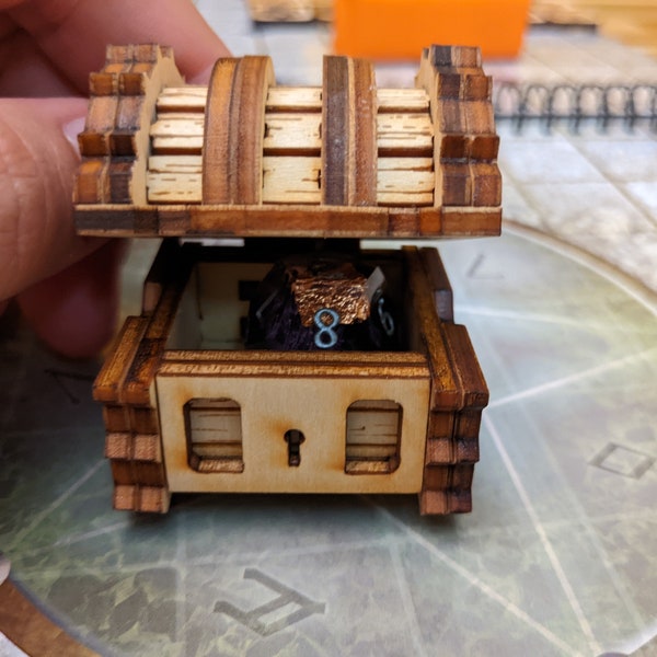 A Mimic chest dice jail that can be used for DnD dice storage. This dnd dice box (or dnd dice holder) looks like a wooden chest.
