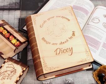 May include: A wooden box shaped like a book with the text "Grab your weapons things are about to get Dicey" and a D20 dice symbol engraved on the front. The box is open and has a set of dice inside.