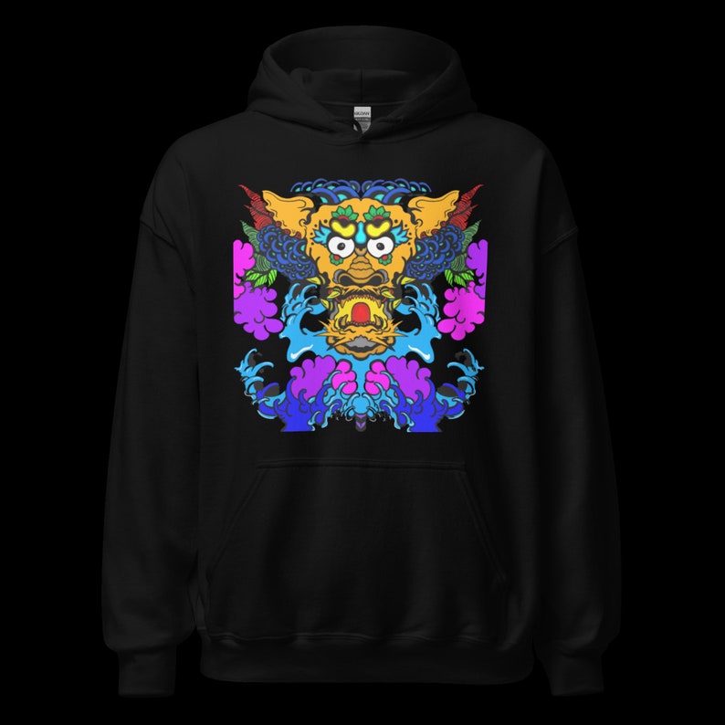 May include: Black hoodie featuring a vibrant, detailed graphic of a mythical creature. The design incorporates yellow, blue, purple, and pink hues, with intricate patterns and stylized waves. The hoodie has a drawstring hood and a kangaroo pocket.