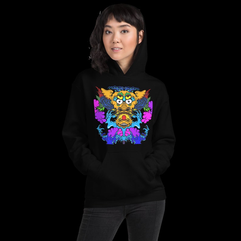 May include: Black hoodie featuring a vibrant, colorful graphic of a mythical creature. The design includes yellow, blue, purple, and pink elements, creating a striking visual contrast. The hoodie has a classic kangaroo pocket and a drawstring hood.