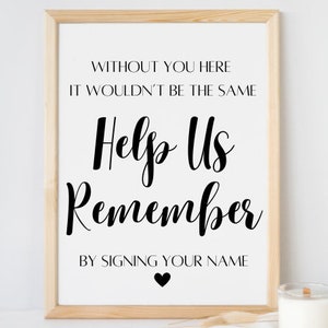 Puede incluir: Un cartel blanco con marco negro y texto negro que dice "Sin ti aquí no sería lo mismo. Ayúdanos a recordar. Firmando tu nombre." Hay un pequeño corazón negro en la parte inferior del cartel.