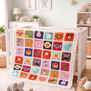 May include: A white crochet baby blanket featuring a grid of colorful square patches, each displaying a different stuffed animal face including a monkey, elephant, lion, turtle, owl, and frog, with a scalloped white border edge.