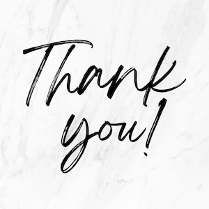May include: A handwritten message on a white marble background that says "Thank you!"