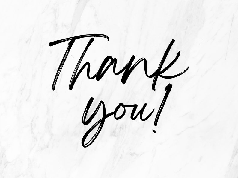 May include: A handwritten message on a white marble background that says "Thank you!"