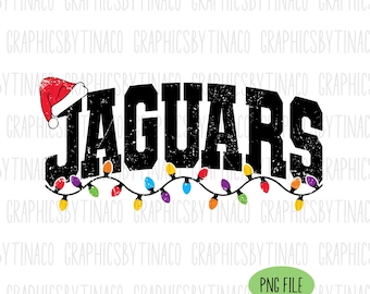May include: Black "JAGUARS" text with a Santa hat and a string of colorful Christmas lights. The design is on a white background, with the text "PNG FILE" in a green oval.