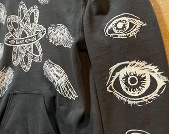 Biblically Accurate Angel Hoodie: Hand-printed Eye Wing Design