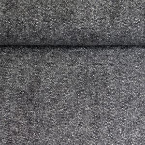 May include: Close-up of a textured, dark gray fabric with a subtle speckled pattern. The material appears to be folded over, revealing a layered effect. The fabric has a woven appearance, suggesting a durable textile.