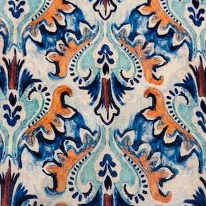 lightweight cotton fabric with a majolica pattern in cream, blue, turquoise and terracotta