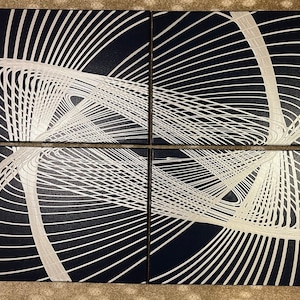 May include: A set of four black canvas panels with a white geometric design. The design is made up of intersecting lines that create a pattern of circles and squares.
