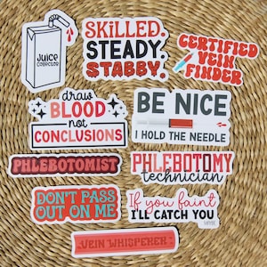 May include: A selection of colourful stickers with medical-themed phrases. The stickers feature text like "Skilled, Steady, Stabby," "Certified Vein Finder," and "Draw Blood, Not Conclusions." The stickers are in red, white, and black.