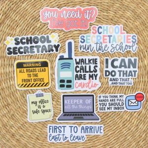 May include: A collection of ten vinyl stickers featuring school office themes. Text includes "You need it? I've got it!", "School Secretary", "School Secretaries run the school", "Walkie calls are my cardio", "I can do that", "My office is a safe space", "Keeper of all the things", "If you think my hands are full you should see my inbox", and "First to arrive last to leave".