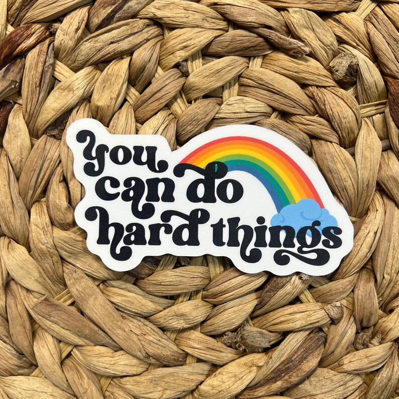 May include: A white sticker with a rainbow and the text "You can do hard things" in black.