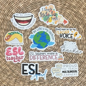 May include: A set of nine colorful stickers with various phrases related to teaching English as a Second Language (ESL). The stickers feature illustrations of a smiling mouth, a globe, a megaphone, a taco, and speech bubbles. The text on the stickers includes phrases like "We all laugh in the same language", "I teach kids to talk back", "The world is my classroom", "Don't make me use my teacher voice", "Will teach for tacos", "ESL teachers make a difference", "ESL teacher", and "Proud to teach multilingual learners".