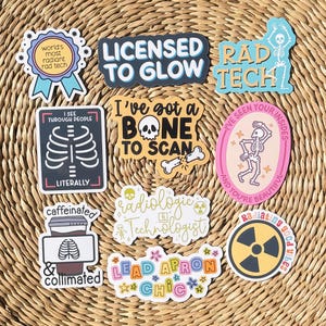 May include: A collection of nine vinyl stickers featuring radiologic technology themes. Designs include skeletons, radiation symbols, and text such as Licensed to Glow, I've Got a Bone to Scan, and Lead Apron Chic, rendered in various colors and fonts.