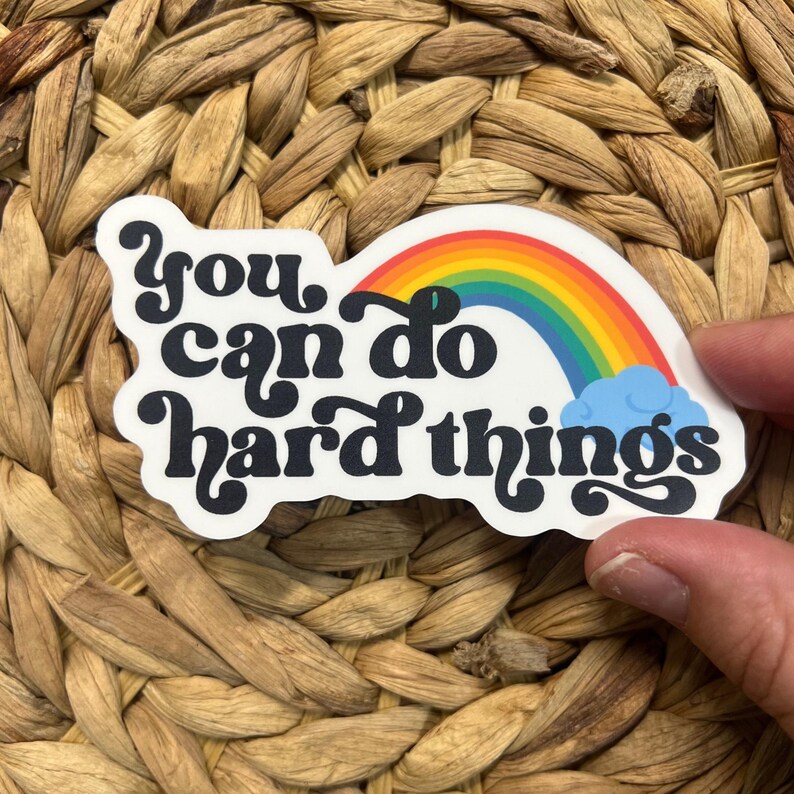 May include: A white sticker with a rainbow and the text "You can do hard things" in black.