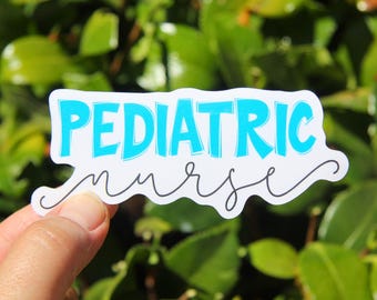 May include: A white sticker with the words "PEDIATRIC nurse" in a teal and black handwritten font. The sticker is held in a hand against a background of green leaves.