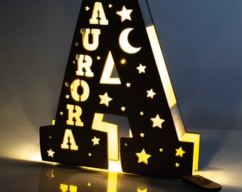 Customizable wooden LED lamp in the shape of a letter with personalized name. Artisan product 100% Made in Italy