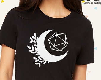 May include: Black t-shirt with a white crescent moon and a white geometric design inside the moon. The design is reminiscent of a 20-sided die.