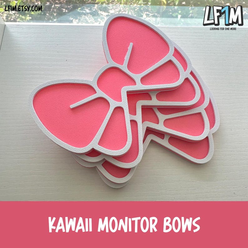 May include: Pink and white monitor bows stacked on a white surface. The bows have a layered design with a pink center and white outline. The text "KAWAII MONITOR BOWS" is at the bottom of the image.